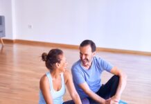 시니어 바레 최초 교육기관/ 바레 자격증 man in white tank top and gray pants sitting on blue yoga mat