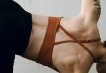 국내유일 정식 사단법인 바레 자격증 마이바레 필라테스 a woman in a brown bikini doing a handstand