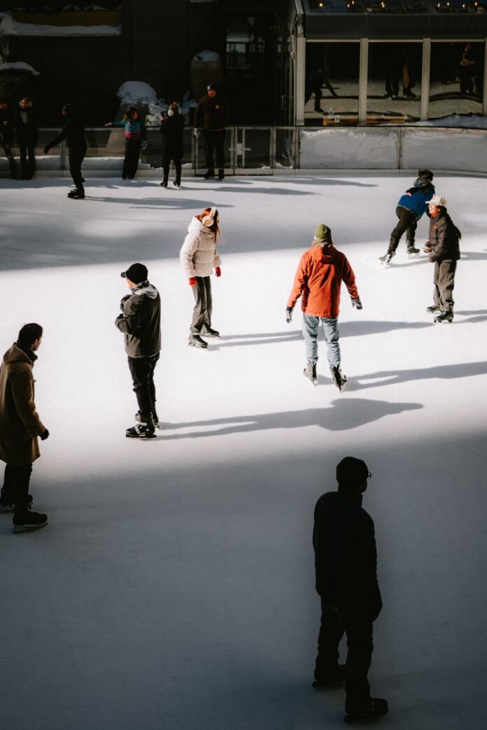 People ice skating on an outdoor rink